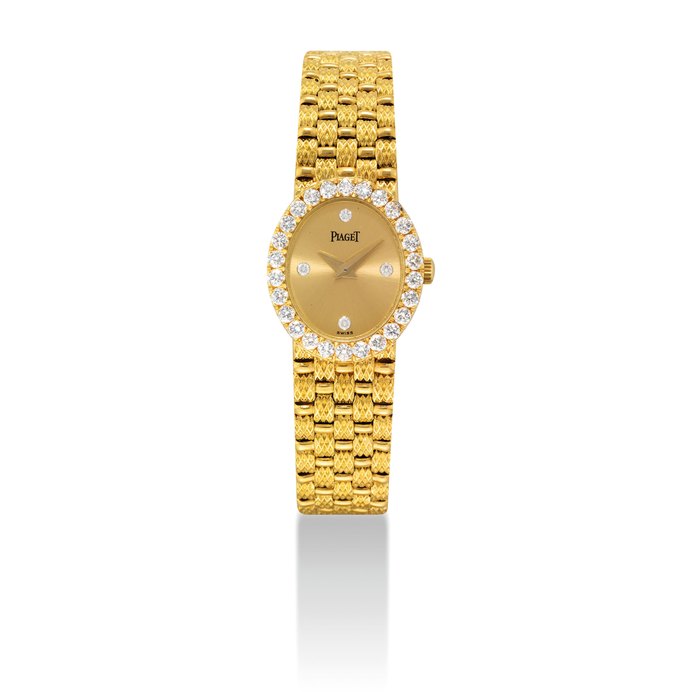 PIAGET. A LADY'S 18K GOLD AND DIAMOND-SET OVAL BRACELET WATCH SIGNED PIAGET, REF. 8326 D 23, MOVEMENT NO. 186'111, CASE NO. 611'116, CIRCA 1990