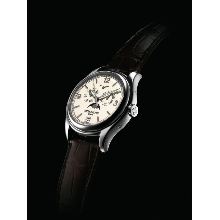 PATEK PHILIPPE. A FINE 18K WHITE GOLD AUTOMATIC ANNUAL CALENDAR WRISTWATCH WITH SWEEP CENTRE SECONDS, POWER RESERVE, MOON PHASES, ORIGINAL CERTIFICATE AND BOX SIGNED PATEK PHILIPPE, GENEVE, REF. 5146, MOVEMENT NO. 3'605'161, CASE NO. 4'418'193, CIRCA 2007