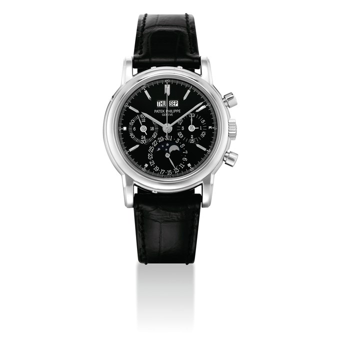 PATEK PHILIPPE. A VERY FINE AND VERY RARE 18K WHITE GOLD PERPETUAL CALENDAR CHRONOGRAPH WRISTWATCH WITH MOON PHASES, LEAP YEAR INDICATION AND BLACK DIAL, ORIGINAL CERTIFICATE, CASE BACK AND BOX SIGNED PATEK PHILIPPE, GENEVE, REF. 3970, MOVEMENT NO. 3'046'162, CASE NO. 4'103'637, MANUFACTURED IN 2000
