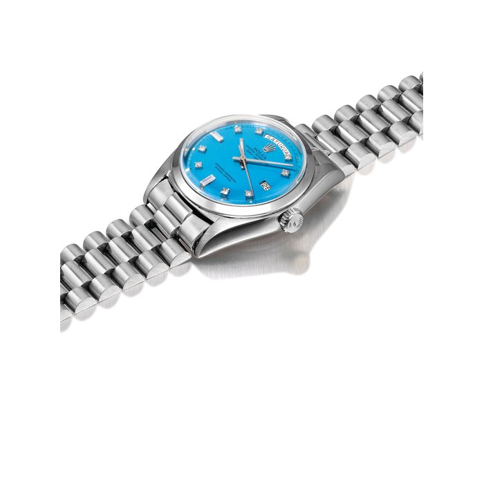 ROLEX. A FINE, ATTRACTIVE AND RARE 18K WHITE GOLD AND DIAMOND-SET AUTOMATIC WRISTWATCH WITH SWEEP CENTRE SECONDS, DAY, DATE, BRACELET AND TURQUOISE LACQUERED DIAL SIGNED ROLEX, OYSTER PERPETUAL, DAY-DATE MODEL, REF. 1803, CASE NO. 3'238'388, CIRCA 1972