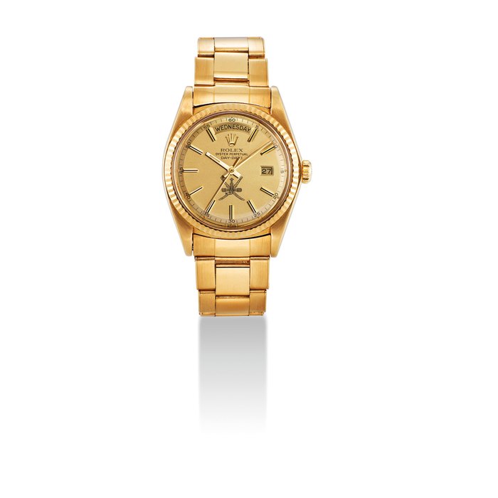 ROLEX. A FINE, ATTRACTIVE AND RARE 18K GOLD AUTOMATIC WRISTWATCH WITH SWEEP CENTRE SECONDS, DAY, DATE, BRACELET AND OMAN DIAL SIGNED ROLEX, OYSTER PERPETUAL, DAY-DATE MODEL, REF. 1803, CASE NO. 5'176'958, CIRCA 1977