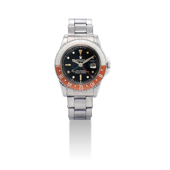 Rolex ROLEX. A RARE STAINLESS STEEL AUTOMATIC DUAL TIME WRISTWATCH WITH SWEEP CENTRE SECONDS, DATE, BRACELET, EXCLAMATION DIAL, POINTED CROWN GUARDS AND VERY UNUSUAL HANDS SIGNED ROLEX, OYSTER-PERPETUAL, GMT-MASTER MODEL, REF. 1675, CASE NO. 695'325, CIRCA 1961 · 1675