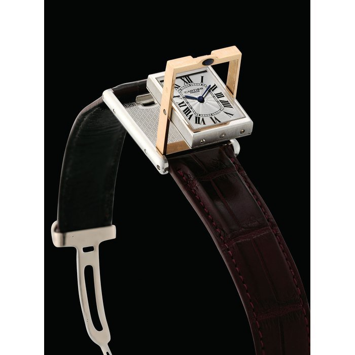 Cartier CARTIER. A RARE PLATINUM AND 18K PINK GOLD LIMITED EDITION RECTANGULAR REVERSIBLE WRISTWATCH SIGNED CARTIER, COLLECTION PRIVÉE, TANK BASCULANTE MODEL, NO. 054/100 MG, CASE NO. 2500E, CIRCA 1997