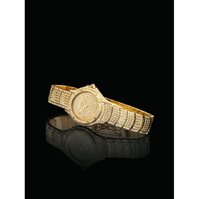Cartier CARTIER. A LADY'S FINE 18K GOLD AND DIAMOND-SET WRISTWATCH WITH BRACELET SIGNED CARTIER, COUGAR MODEL, CASE NOS. 887'907 AND C003135, CIRCA 1993