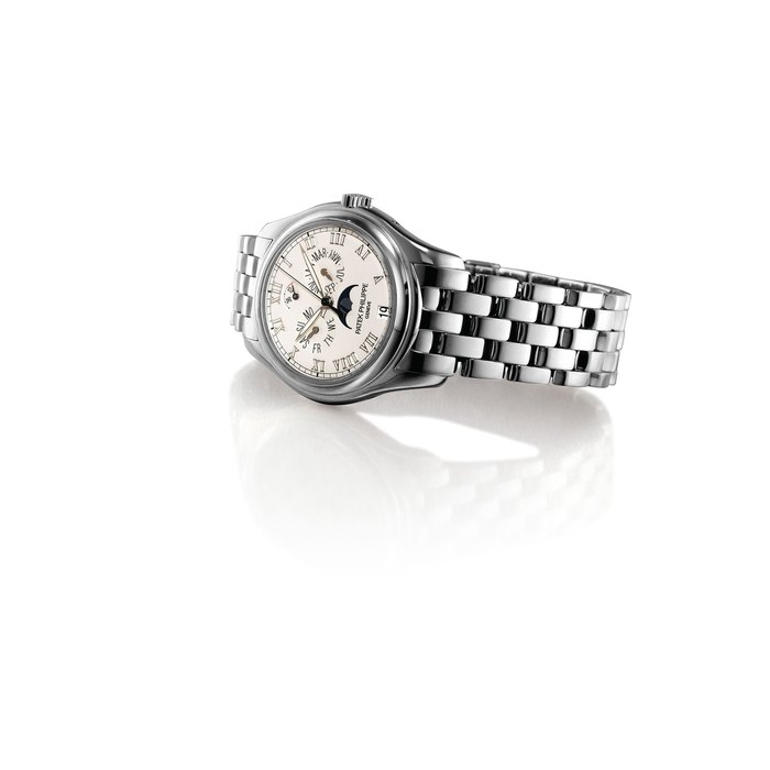 PATEK PHILIPPE. A FINE 18K WHITE GOLD AUTOMATIC ANNUAL CALENDAR WRISTWATCH WITH SWEEP CENTRE SECONDS, POWER RESERVE, MOON PHASES AND BRACELET SIGNED PATEK PHILIPPE, GENEVE, REF. 5036, MOVEMENT NO. 3'287'522, CASE NO. 4'190'211, CIRCA 2002