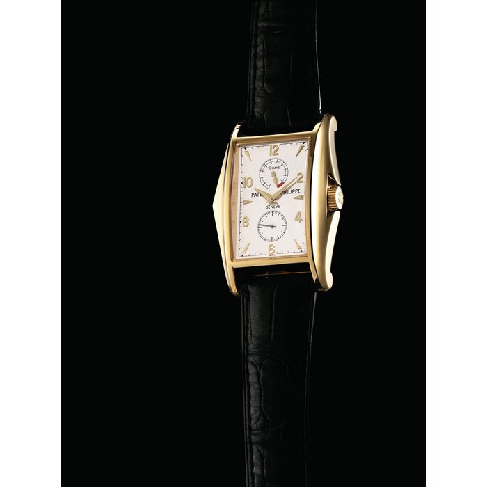 PATEK PHILIPPE. A FINE AND RARE 18K GOLD LIMITED EDITION RECTANGULAR WRISTWATCH WITH 10 DAY POWER RESERVE, ORIGINAL CERTIFICATE, COMMEMORATIVE MEDAL AND BOX, MADE TO COMMEMORATE THE MILLENIUM SIGNED PATEK PHILIPPE, GENEVE, REF. 5100, MOVEMENT NO. 3'201'634, CASE NO. 4'098'577, CIRCA 2000