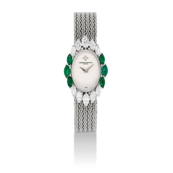 Vacheron Constantin VACHERON CONSTANTIN. A LADY'S 18K WHITE GOLD, DIAMOND AND EMERALD-SET OVAL BRACELET WATCH SIGNED VACHERON CONSTANTIN, GENEVE, CASE NO. 504876P, CIRCA 1975