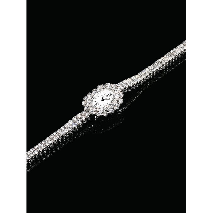 Vacheron Constantin VACHERON CONSTANTIN. A LADY'S FINE 18K WHITE GOLD AND DIAMOND-SET OVAL WRISTWATCH SIGNED VACHERON-CONSTANTIN, GENEVE, CASE NO. 9105, CIRCA 1940