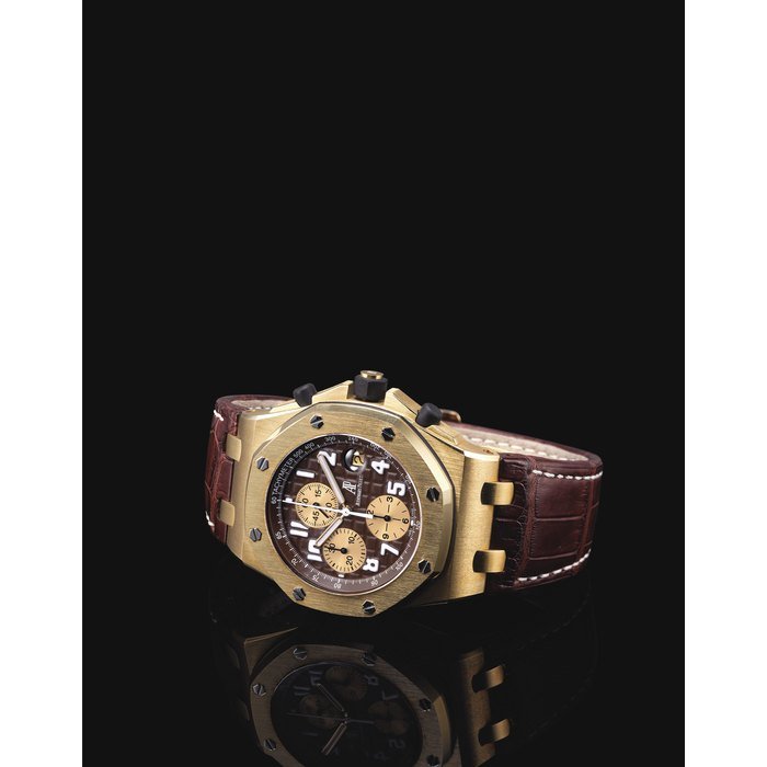 Audemars Piguet AUDEMARS PIGUET. A FINE AND OVERSIZED 18K GOLD LIMITED EDITION AUTOMATIC CHRONOGRAPH WRISTWATCH WITH DATE SIGNED AUDEMARS PIGUET, ROYAL OAK OFFSHORE ARNOLD SCHWARZENEGGER MODEL, CASE NO. F 01074, CIRCA 2003