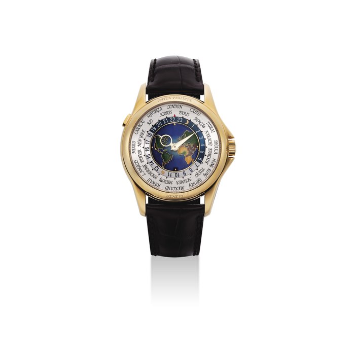 PATEK PHILIPPE. A FINE AND VERY RARE 18K GOLD AUTOMATIC WORLD TIME WRISTWATCH WITH CLOISONNÉ ENAMEL DIAL, ORIGINAL CERTIFICATE AND BOX SIGNED PATEK PHILIPPE, GENEVE, REF. 5131, MOVEMENT NO. 5'626'409, CASE NO. 4'540'681, CIRCA 2012