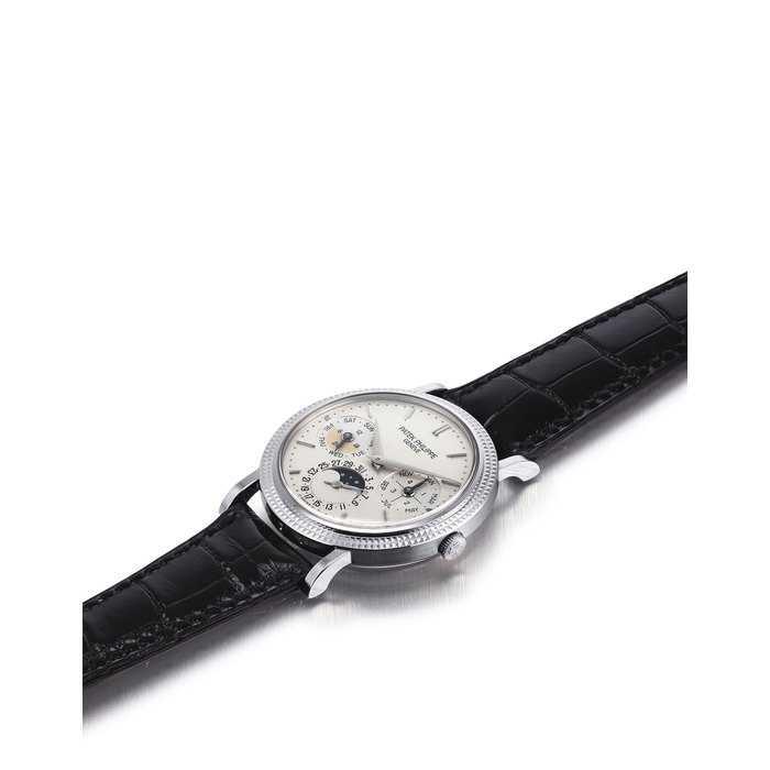 PATEK PHILIPPE. A FINE AND RARE 18K WHITE GOLD AUTOMATIC PERPETUAL CALENDAR WRISTWATCH WITH MOON PHASES, 24 HOUR AND LEAP YEAR INDICATION, ORIGINAL CERTIFICATE, ADDITIONAL CASE BACK AND BOX SIGNED PATEK PHILIPPE, GENEVE, REF. 5039, MOVEMENT NO. 3'127'577, CASE NO. 4'285'260, CIRCA 2004