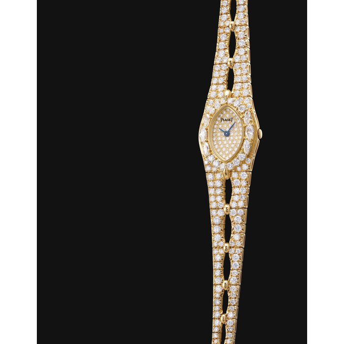 PIAGET. A LADY'S 18K GOLD AND DIAMOND-SET OVAL WRISTWATCH SIGNED PIAGET, REF. 85513 V 92, CASE NO. 457'842, CIRCA 1985