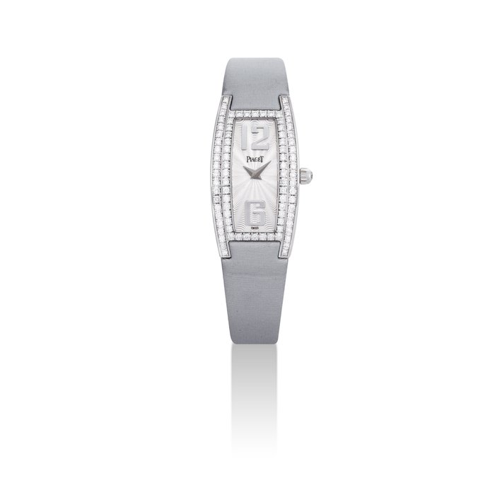 PIAGET. A LADY'S 18K WHITE GOLD AND DIAMOND-SET TONNEAU-SHAPED WRISTWATCH SIGNED PIAGET, LIMELIGHT MODEL, REF. P10120, CASE NO. 926'093, CIRCA 2008