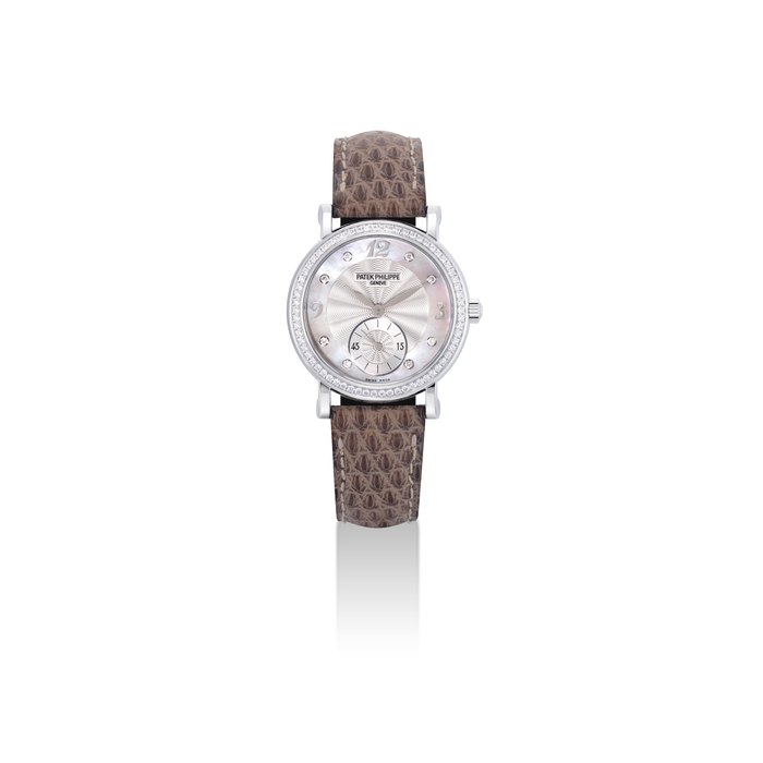 Patek Philippe PATEK PHILIPPE. A LADY'S FINE 18K WHITE GOLD AND DIAMOND-SET WRISTWATCH WITH MOTHER-OF-PEARL DIAL SIGNED PATEK PHILIPPE, GENEVE, CALATRAVA MODEL, REF. 4959, MOVEMENT NO. 3'563'567, CASE NO. 4'926'193, CIRCA 2008, Price & Market Data