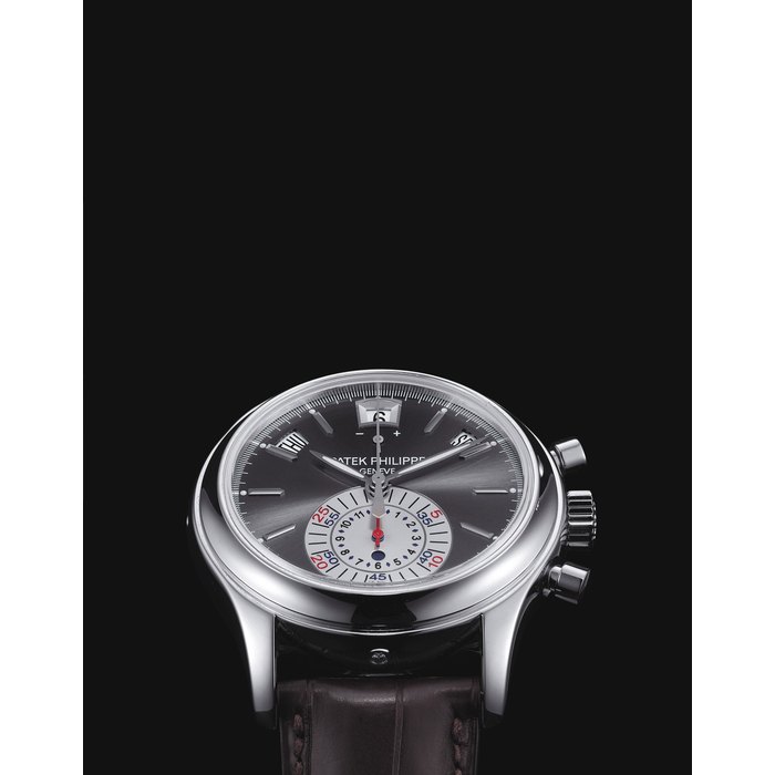 PATEK PHILIPPE. A FINE PLATINUM AUTOMATIC ANNUAL CALENDAR CHRONOGRAPH WRISTWATCH WITH DAY AND NIGHT INDICATION, POWER RESERVE, ORIGINAL CERTIFICATE AND BOX SIGNED PATEK PHILIPPE, GENEVE, REF. 5960, MOVEMENT NO. 3'500'981, CASE NO. 4'325'443, CIRCA 2007
