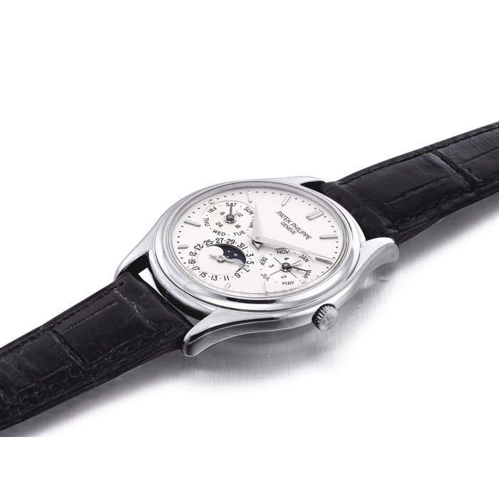 PATEK PHILIPPE. A FINE AND RARE 18K WHITE GOLD AUTOMATIC PERPETUAL CALENDAR WRISTWATCH WITH MOON PHASES, 24 HOUR AND LEAP YEAR INDICATION SIGNED PATEK PHILIPPE, GENEVE, REF. 3940, MOVEMENT NO. 3'125'570, CASE NO. 4'146'563, MANUFACTURED IN 2002