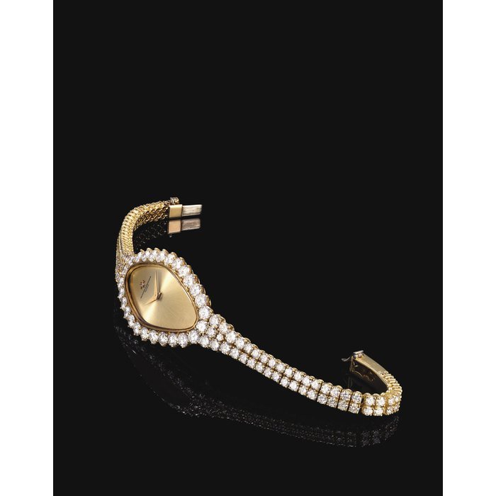 Vacheron Constantin VACHERON CONSTANTIN. A LADY'S 18K GOLD AND DIAMOND-SET LOZENGE-SHAPED WRISTWATCH SIGNED VACHERON CONSTANTIN, GENEVE, CASE NO. 532828P, CIRCA 1990