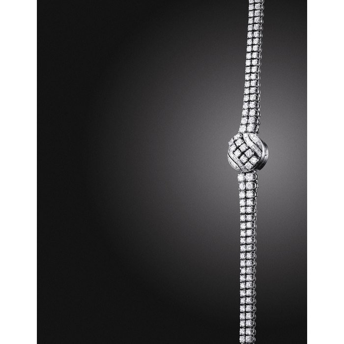 Jaeger-Lecoultre JAEGER-LECOULTRE. A LADY'S FINE PLATINUM AND DIAMOND-SET BRACELET WATCH WITH CONCEALED DIAL SIGNED JAEGER-LECOULTRE, REF. 7303, MOVEMENT NO. 1'517'355, CASE NO. 154'617, MANUFACTURED IN 1961
