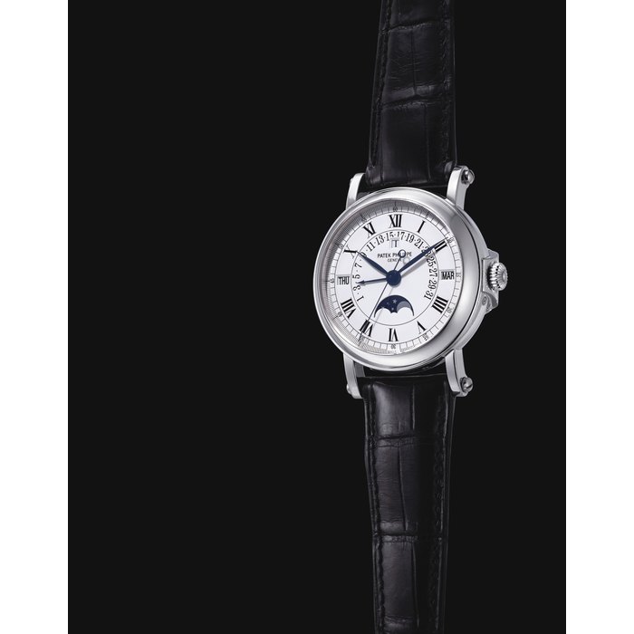 PATEK PHILIPPE. A FINE AND RARE PLATINUM AUTOMATIC PERPETUAL CALENDAR WRISTWATCH WITH SWEEP CENTRE SECONDS, RETROGRADE DATE, MOON PHASES AND LEAP YEAR INDICATION SIGNED PATEK PHILIPPE, GENEVE, REF. 5059, MOVEMENT NO. 1'958'848, CASE NO. 4'138'705, MANUFACTURED IN 2001