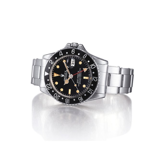 Rolex ROLEX. A RARE STAINLESS STEEL AUTOMATIC DUAL TIME WRISTWATCH WITH SWEEP CENTRE SECONDS, DATE AND BRACELET, MADE FOR THE PERUVIAN AIRFORCE SIGNED ROLEX, OYSTER PERPETUAL, GMT-MASTER, REF. 1675, CASE NOS. 3'386'356 AND 304, CIRCA 1972 · 1675
