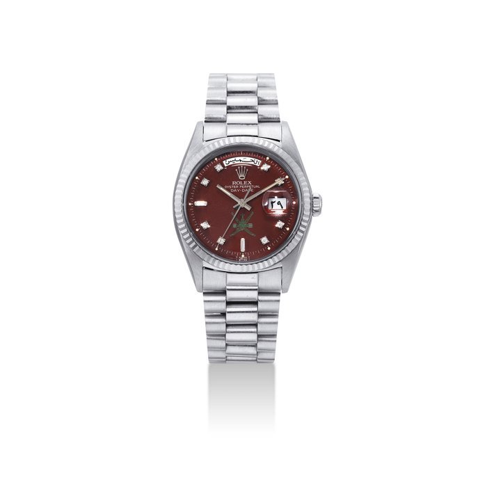 Rolex ROLEX. A VERY FINE, ATTRACTIVE AND EXTREMELY RARE 18K WHITE GOLD AND DIAMOND-SET AUTOMATIC WRISTWATCH WITH SWEEP CENTRE SECONDS, DAY, DATE, BRACELET AND OXBLOOD LACQUERED DIAL, MADE FOR THE SULTANATE OF OMAN SIGNED ROLEX, OYSTER PERPETUAL, DAY-DATE MODEL, REF. 1803, CASE NO. 2'262'472, CIRCA 1970