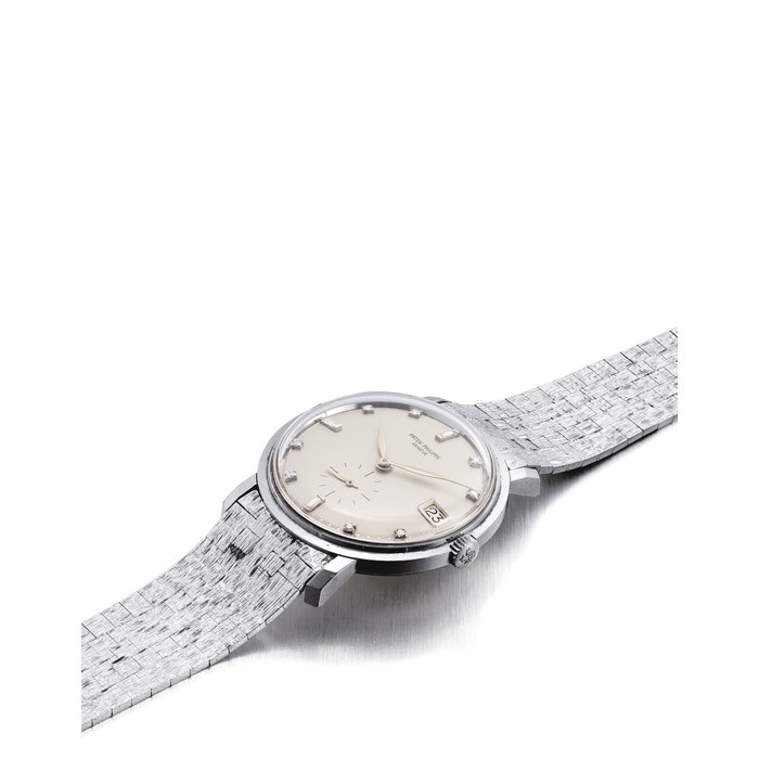 PATEK PHILIPPE. AN 18K WHITE GOLD AND DIAMOND-SET AUTOMATIC WRISTWATCH WITH DATE AND BRACELET SIGNED PATEK PHILIPPE, GENEVE, REF. 3445, MOVEMENT NO. 1'122'149, CASE NO. 316'706, MANUFACTURED IN 1964