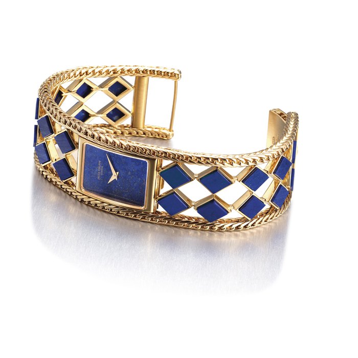 PATEK PHILIPPE. A VERY FINE, RARE AND UNUSUAL 18K GOLD AND LAPIS LAZULI-SET RECTANGULAR BRACELET WATCH SIGNED PATEK PHILIPPE, GENEVE, REF. 4241/906, MOVEMENT NO. 1'399'069, CASE NO. 2'742'956, MANUFACTURED IN 1980