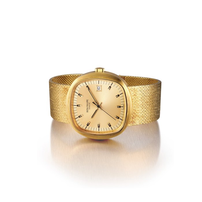 PATEK PHILIPPE. A RARE OVERSIZED 18K GOLD CUSHION-SHAPED ELECTRONIC BRACELET WATCH WITH SWEEP CENTRE SECONDS AND DATE SIGNED PATEK PHILIPPE, GENEVE, REF. 3587/2, MOVEMENT NO. 5929, CASE NO. 2'699'611, CIRCA 1970