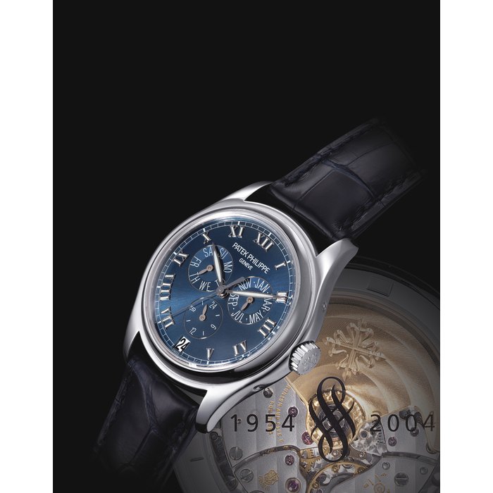 PATEK PHILIPPE. A FINE AND RARE 18K WHITE GOLD LIMITED EDITION AUTOMATIC ANNUAL CALENDAR WRISTWATCH WITH SWEEP CENTRE SECONDS, 24 HOUR INDICATION, ORIGINAL CERTIFICATE AND BOX, MADE TO COMMEMORATE THE 50TH ANNIVERSARY OF SINCERE WATCH LIMITED IN SINGAPORE SIGNED PATEK PHILIPPE, GENEVE, REF. 5035, MOVEMENT NO. 3'137'115, CASE NO. 4'248'207, CIRCA 2004