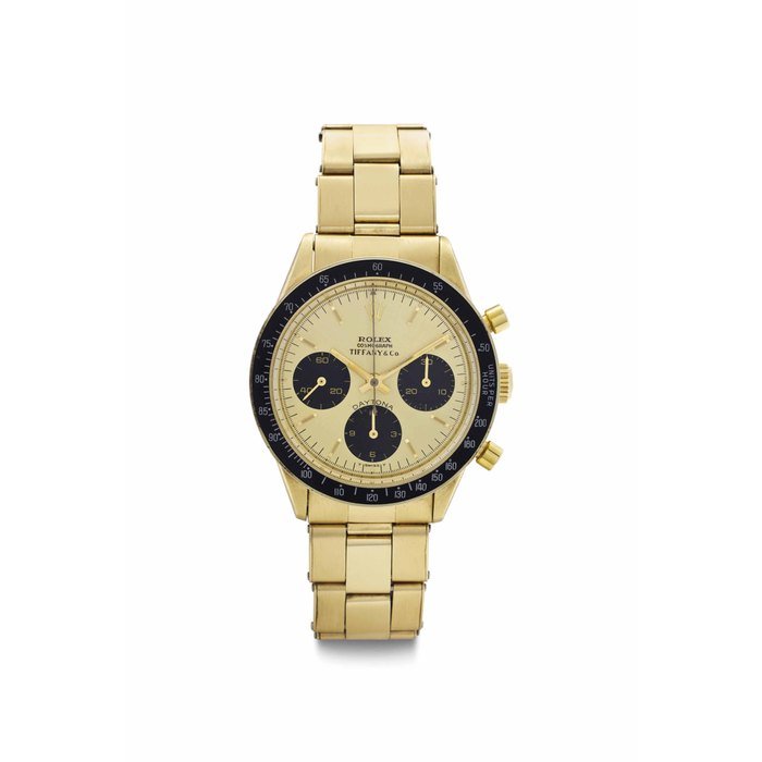 Rolex And Tiffany & Co Rolex and Tiffany & Co. A Fine and Rare 14k Gold Chronograph Wristwatch with Bracelet SIGNED ROLEX, RETAILED BY TIFFANY & CO., COSMOGRAPH, DAYTONA, REF. 6264, CASE NO. 2'802'708, CIRCA 1971