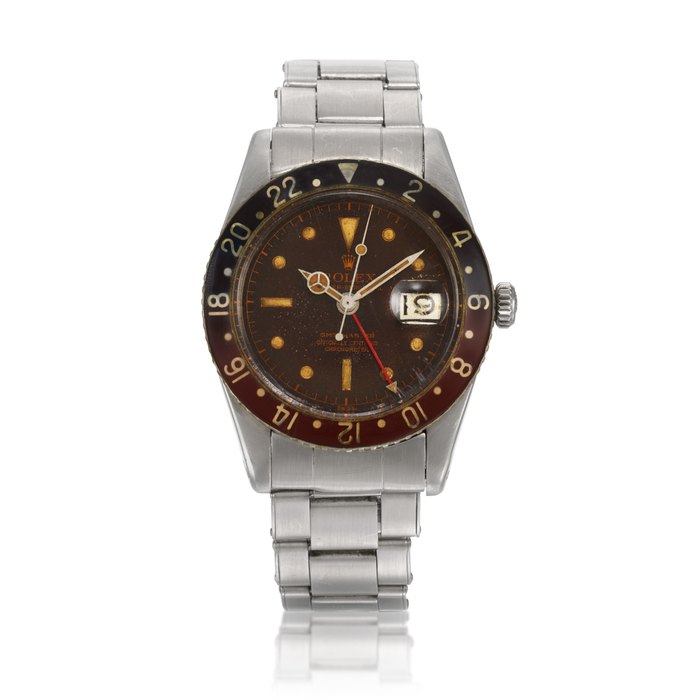 Rolex ‘Pussy Galore’ GMT-Master, Ref. 6542 Stainless steel dual time zone wristwatch with a tropical dial, date and bracelet Circa 1957