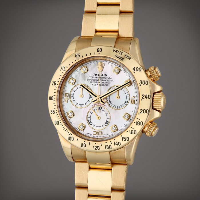 Rolex Reference 116528H Daytona | A yellow gold and diamond-set automatic chronograph wristwatch with bracelet and mother-of-pearl dial, Circa 2007 · 116528H
