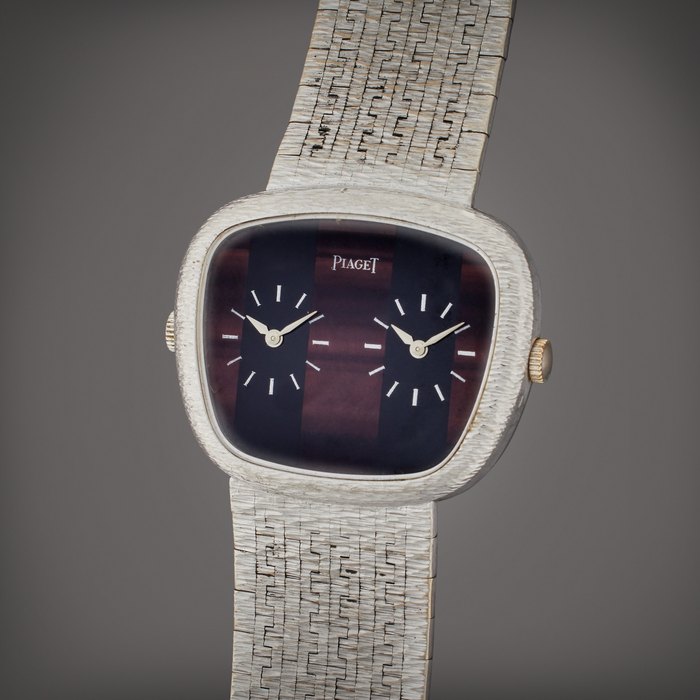 Piaget Reference 69455 A6 | A white gold dual time bracelet watch with tiger's eye and onyx dial, Circa 1975