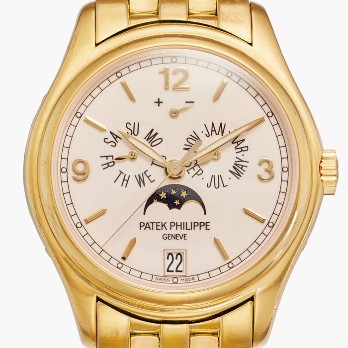 Patek Philippe Reference 5146/1J-001 | A yellow gold automatic annual calendar wristwatch with moon phases and power reserve indication, Circa 2010
