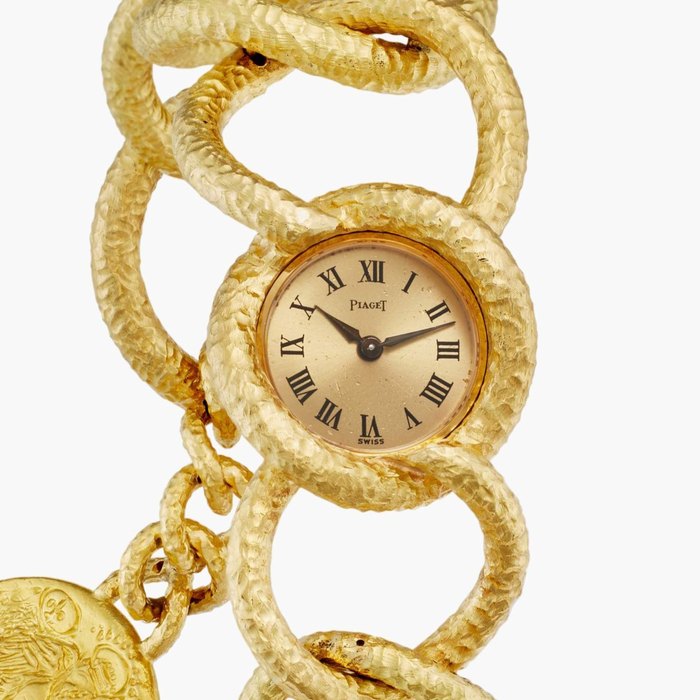 Piaget Reference 3649 D80 Dalí d'Or | A limited edition yellow gold bracelet watch with coin pendant, Circa 1972