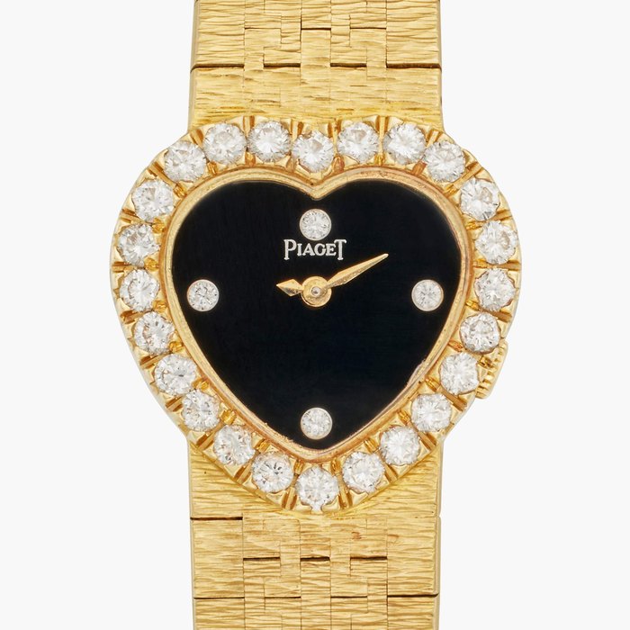 Piaget Reference 8446 A 6 | A yellow gold and diamond-set heart-shaped bracelet watch with onyx dial, Circa 1986