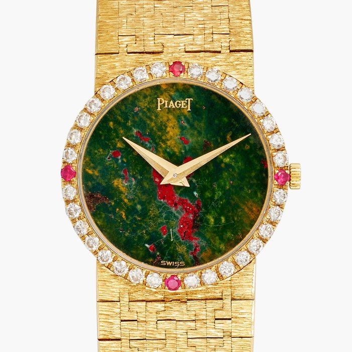 Piaget Reference 9706 A6 | A yellow gold, diamond and ruby-set bracelet watch with bloodstone dial, Circa 1965