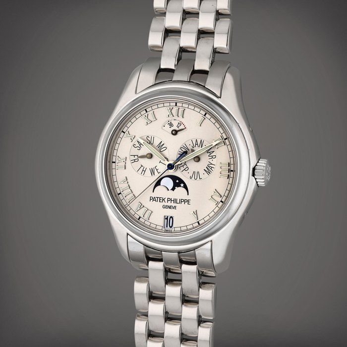Patek Philippe Reference 5036/1G | A white gold automatic annual calendar wristwatch with moon phases and bracelet, Circa 2005