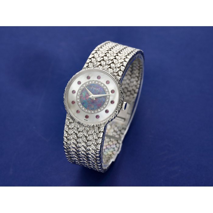 Piaget Reference 9005 D 2 A white gold, mother-of-pearl, opal, diamond and ruby-set bracelet watch, Circa 1975
