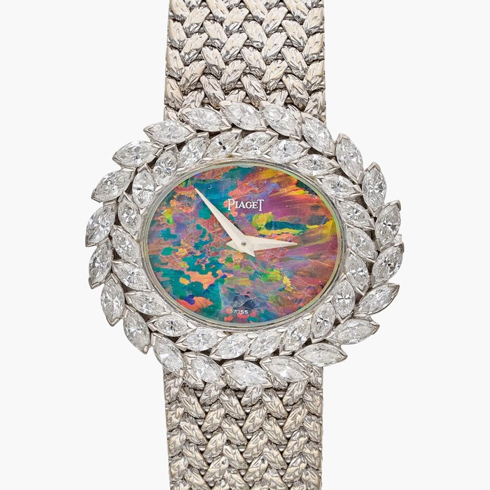 Piaget Reference 9385 A6 | A white gold and diamond-set bracelet watch with opal dial, Circa 1980