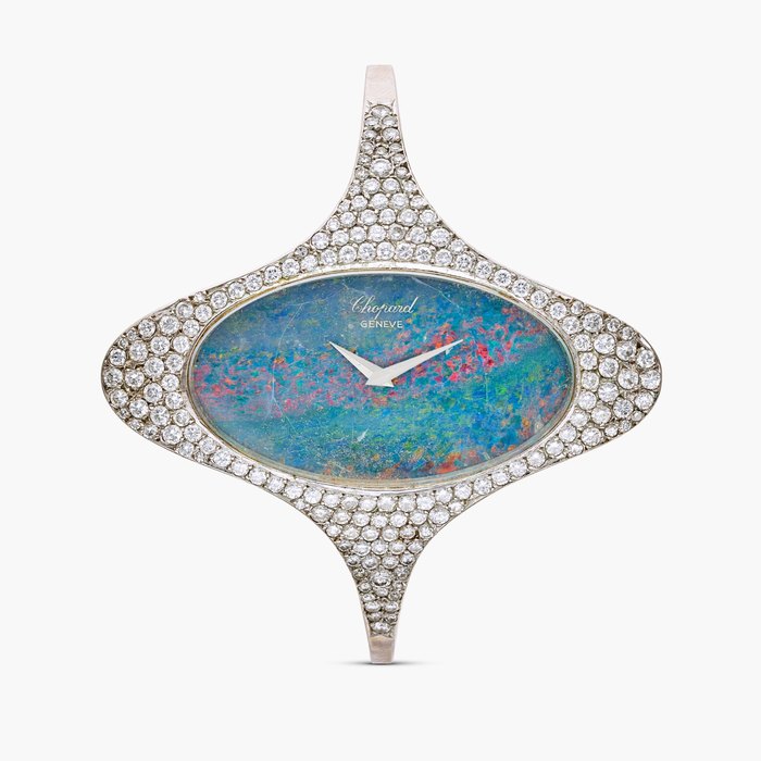 Chopard Reference 5038-1 | A white gold and diamond-set cuff watch with opal dial, Circa 1970