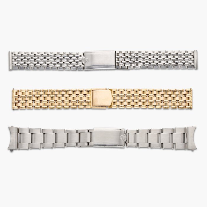 Rolex A group consisting of two stainless steel and one pink gold bracelets, Circa 1940 - 1968