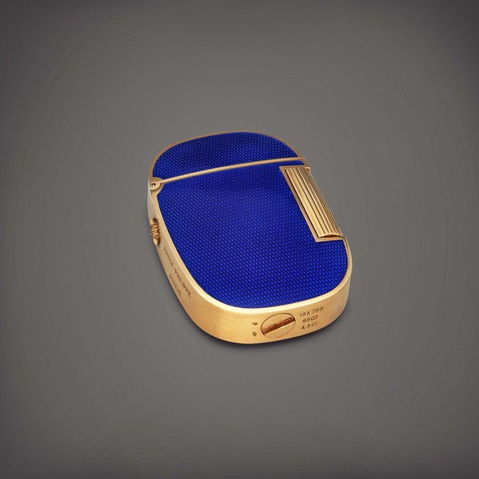 Patek Philippe Golden Ellipse, Reference 9507 | A yellow gold and blue enamel lighter | Circa 1978