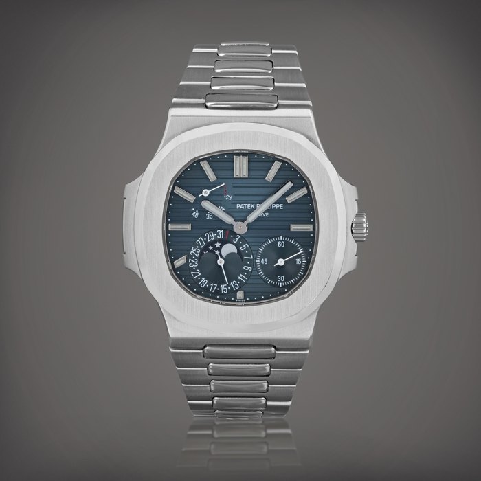 Patek Philippe Nautilus, reference 5712/1A-001    Montre bracelet en acier avec date, phases de lune et indication de la réserve de marche |  Stainless steel wristwatch with date, moon phases, power reserve indication and bracelet     Vers 2008 |  Circa 2008