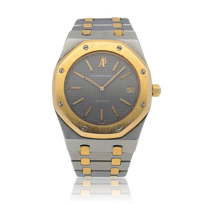 Audemars Piguet Royal Oak, Ref. 5402  Stainless steel and yellow gold wristwatch with date and bracelet   Circa 1980