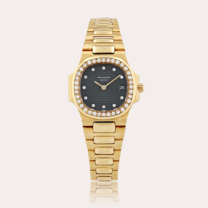 Patek Philippe 'Mini' Nautilus, reference 4700/3    Montre bracelet en or jaune sertie de diamants avec date |  Yellow gold an diamond-set wristwatch with date and bracelet    Vers 1981 |  Circa 1981