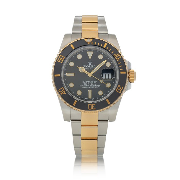 Rolex Submariner, Ref. 116613LN Stainless steel and yellow gold wristwatch with date and bracelet Circa 2015 | 勞力士 116613LN型號「Submariner」精鋼及黃金鍊帶腕錶備日期顯示，年份約2015