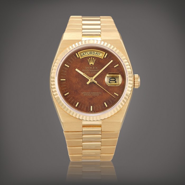 Rolex Oyster Quartz Day-Date, Reference 19018 | A yellow gold bracelet watch with day, date and wood dial, Circa 1980 | 勞力士 | Oyster Quartz Day-Date 型號19018 | 黃金鏈帶腕錶，備日期、星期顯示及木製錶盤，約1980年製