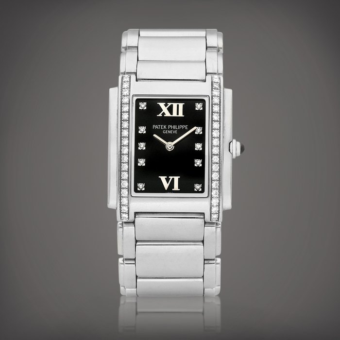 Patek Philippe Twenty~4, Reference 4910 | A stainless steel and diamond-set wristwatch with bracelet, Circa 2000 | 百達翡麗 | Twenty~4 型號4910 | 精鋼鑲鑽石鏈帶腕錶，約2000年製