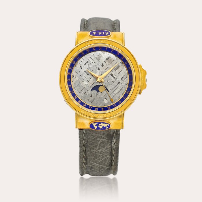 Corum Meteorite Peary, Reference 61.450.56 | A limited edition yellow gold wristwatch with date, moon phases and meteorite dial, Circa 1990 | 崑崙 | Meteorite Peary 型號61.450.56 | 限量版黃金腕表，備日期、月相及隕石錶盤，約1990年製